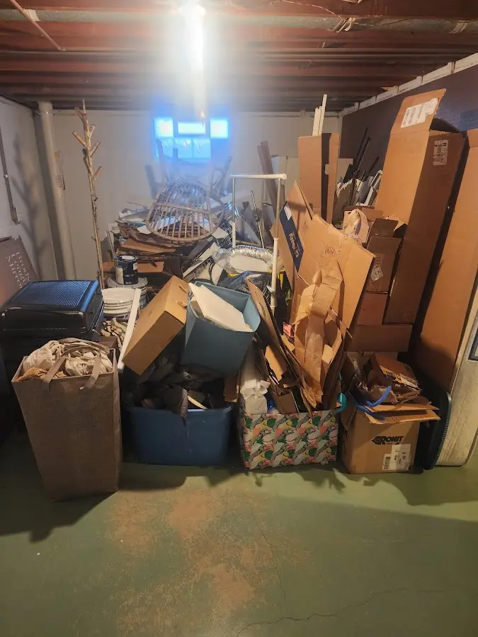 Roll-off dumpster container at job site for Yard Waste Dumpster Rental in Lindenhurst